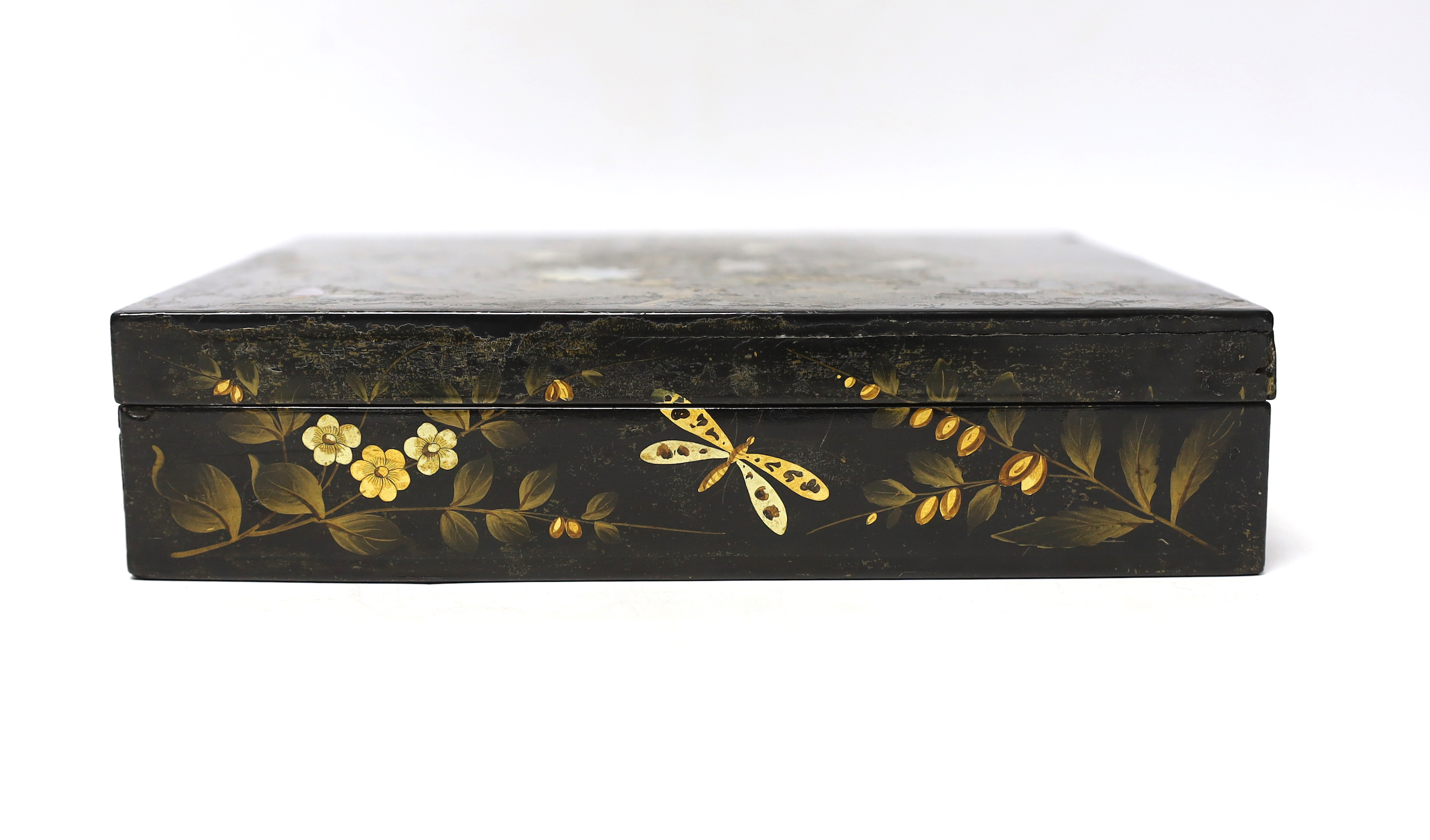 A 19th century lacquer games box with sectional interior and a collection of 49 mother of pearl gaming counters, some armorial, 22 x 19 x 5cm
